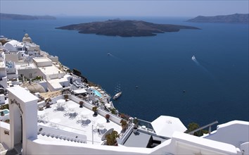 View over the island capital Fira, also Thira, located on the crater rim, in the background