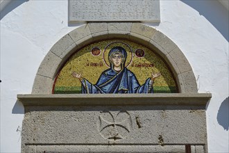 Cross-domed church of Diasososuan, close-up of a mosaic showing Mary with outstretched arms,