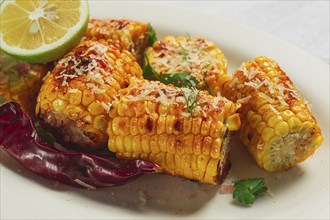 Grilled corn with spices, top view, no people, homemade