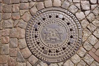 Manhole cover with the coat of arms of the city of Stade, Hanseatic city, district of Stade, Lower