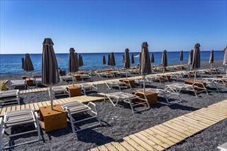 Beach, empty, organised, with sun loungers and parasols, catering, bay at Koutsounari Beach, on the