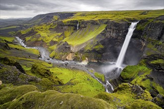 River and waterfalls at a canyon with green moss, Haifoss and Granni waterfall at a canyon, Fossa