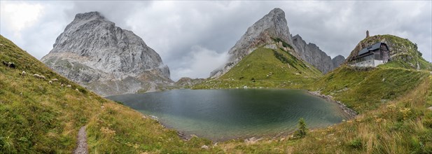 Panorama, Wolayersee and Alpine Club hut Wolayerseehütte, rocky cloudy mountains, Carnic Alps,