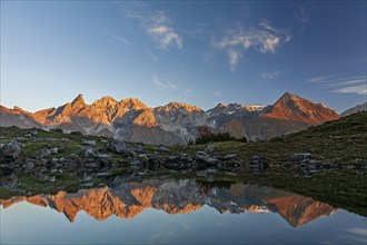 Mountains reflected in a small lake at sunset, autumn, Guggersee, AllgÃ¤u Alps, AllgÃ¤u, Germany,