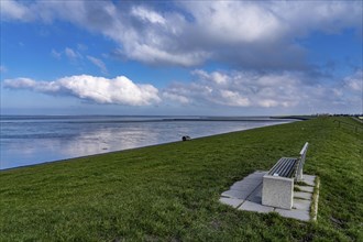 The Wadden Sea, East Frisia, between Bensersiel and Neuharlingersiel, Park bench on the dyke, Lower