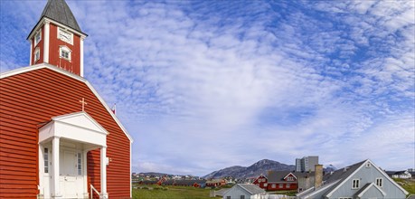 Typical architecture of Greenland capital Nuuk with colored houses located near fjords and icebergs