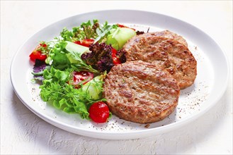 Fried cutlets, turkey, with vegetable salad, top view, no people