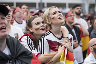 Two female football fans in the fan zone at the Brandenburg Tor during the quarter-final match