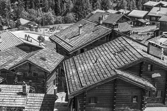 Old wooden houses with wooden shingle roofs, historic centre of Grimentz, black and white photo,