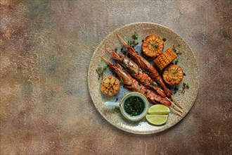 Langoustines on skewers, shrimp kebab, with fried corn, spices and herbs, homemade, no people