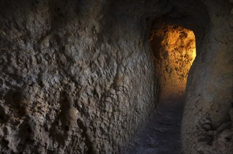 Light at the end of the tunnel, Algar Seco rock formation, coloured rocks and underground caves,