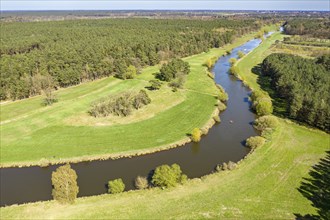 River Aller winding throug cultural landscape west of city Celle, mix of farmland, meadows and