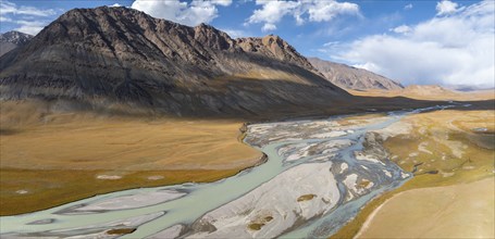 Aerial view, Burkhan mountain valley with meandering river, barren dramatic mountain landscape,