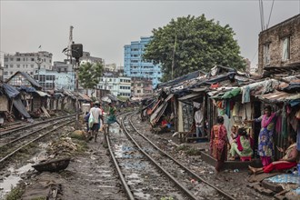 Residents of informal dwellings in Tejgaon, informal settlement built close to a railway line,