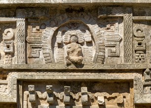 Detail of elaborate decorated stone facade in Monjas complex, Chichen Itza, Mayan ruins, Yucatan,