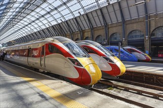 Azuma trains of London North Eastern Railway LNER and Lumo of FirstGroup at King's Cross station in