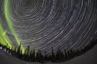 Star trails with Northern Lights over Pallas YllÃ¤stunturi National Park, Lapland, Finland, Europe