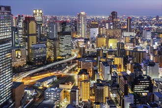 Osaka city from above with the skyline skyscrapers at night in Osaka, Japan, Asia