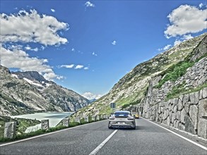 Photo with reduced saturation Porsche 911 GT3 on pass road of Grimselpass, Canton Uri, Switzerland,