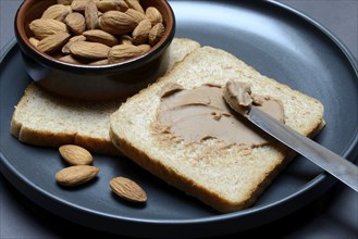 Toast with almond cream and almond shell, spread