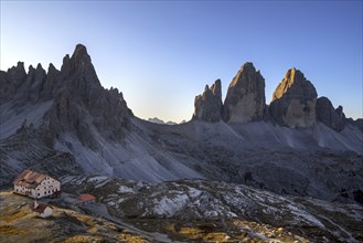 Mountain refuge Dreizinnenhütte, Rifugio Antonio Locatelli at sunrise and the Drei Zinnen, Tre Cime