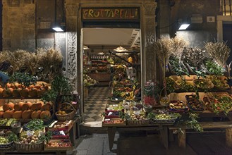 Fruit shop open at night in the historic centre, Genoa, Italy, Europe