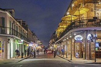 Shops, bars and restaurants at night in Bourbon Street, French Quarter, Vieux Carré in the city New