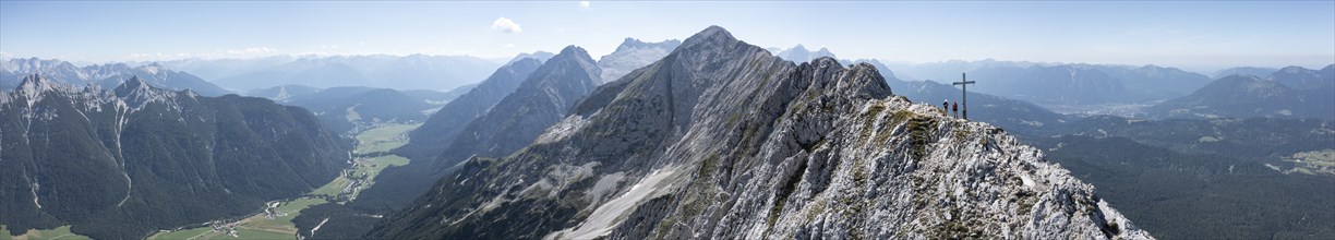 Aerial view, Alpine panorama, hikers at the summit cross, Westliche Wettersteinspitze, Wetterstein