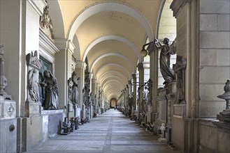 Arcade with tombs at the Monumental Cemetery, Cimitero monumentale di Staglieno), Genoa, Italy,