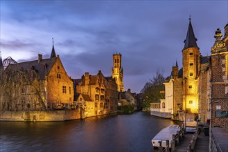 Rozenhoedkaai canal with belfry at dusk, Bruges, Belgium, Europe