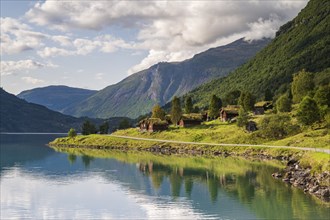 Traditional cabins on the shores of Lake Lovatnet, Breng seter, Loen, Stryn, Norway, Europe