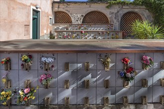 Flower-decorated urn graves in an inner courtyard, Monumental Cemetery, Cimitero monumentale di