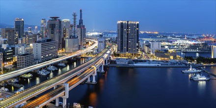 Kobe skyline from above with harbour and elevated road panorama at night in Kobe, Japan, Asia