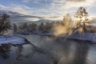 River in the morning light with fog in front of mountains, winter, backlight, Loisach, GroÃŸweil,