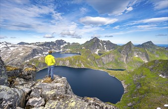 Mountaineers at the summit of Munken, mountain landscape with steep rocky peaks, lakes Tennesvatnet