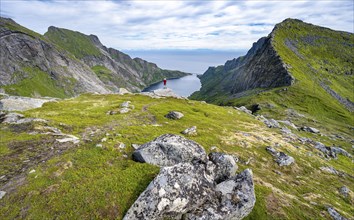 Mountaineers on the hiking trail to Munkebu hut, view of the fjord Djupfjorden and mountain