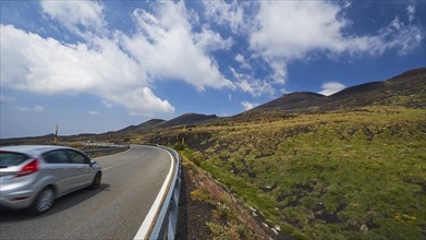 Road, curve, car, Etna summit, green mountain slopes, Etna, volcano, eastern Sicily, Sicily, Italy,