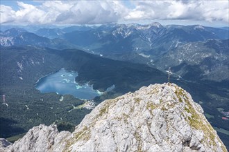 Aerial view, summit cross of the Waxenstein, Eibsee lake and Wetterstein mountains,