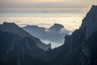 Hoher Kasten and mountains at sunrise, high fog in the valley, view from SÃ¤ntis, Appenzell