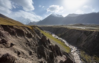 Valley with river Achik Tash between high mountains, mountain landscape with peak Pik Lenin, Osh