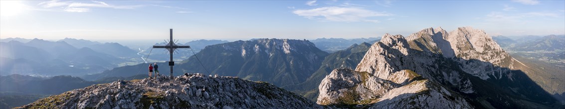 Alpine panorama, Two hikers at the summit, Aerial view, Evening atmosphere in the mountains, Summit