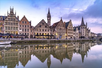 Medieval guild houses of Graslei Kai on the river Leie at dusk, Ghent, Belgium, Europe