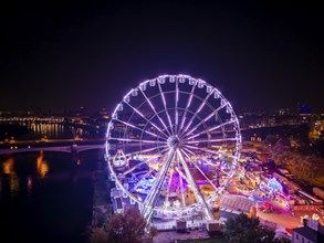 A 55m high illuminated Ferris wheel is the landmark of the fair at the Volksfest grounds on