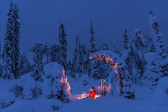 Man at the campfire, Muddus National Park, World Heritage Laponia, Norrbotten, Lapland, Sweden,