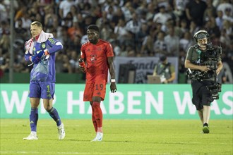 Football match, captain and goalkeeper Manuel NEUER FC Bayern Munich left, takes off his gloves