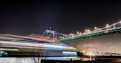 Gothenburg, Sweden, January 4 2014: A ferry passing the Älvsborgs bridge. Long exposure, Europe