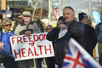 CHRISTCHURCH, NEW ZEALAND, JULY 24, 2021, A man speaks at a protest rally at the Bridge of