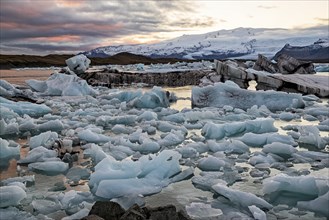 Colorful sunset in Jokulsarlon glacier lagoon in Vatnajokull National Park, Iceland, Europe