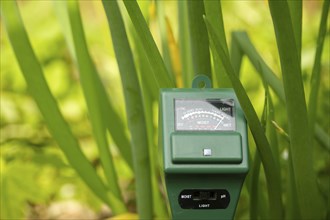 Agricultural meter to measure the soil pH, light and moisture level of the soil in a field with