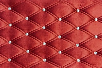 Red upholstery pattern with zircons decoration background